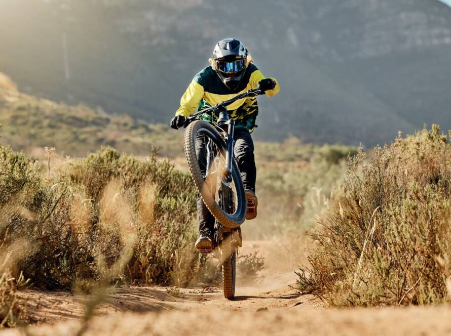Mountain biker, dirt bike and dessert rider cycling on bmx bicycle on nature path, dirt road and ex